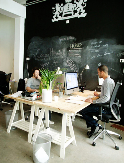 An image of Koen and Joy working behind their desks.